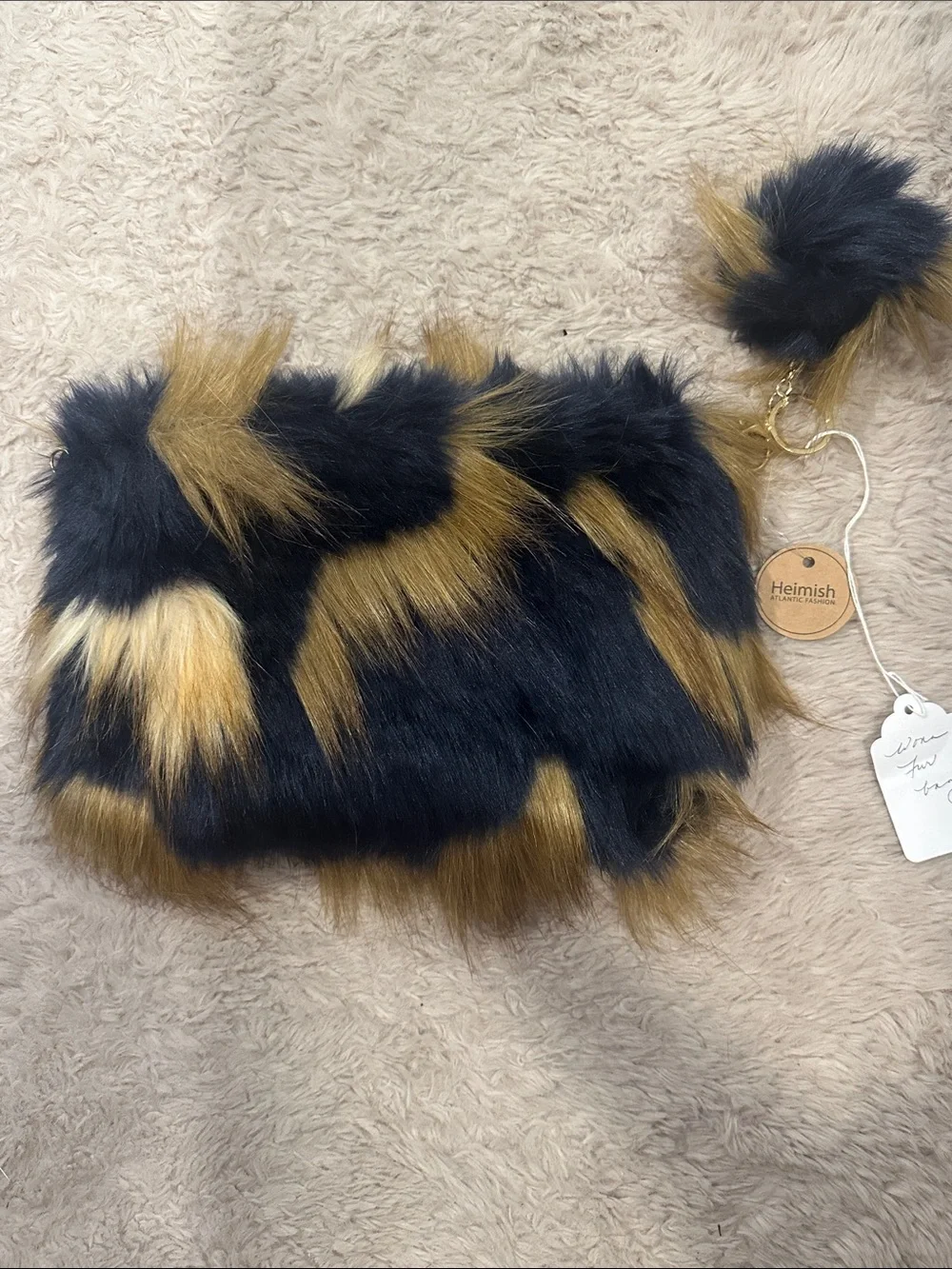 HEIMISH USA Black and Gold Faux Fur Clutch with Pom Keychain